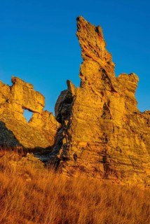 Savannah and huge rock formations at sunset in the Isalo National Park