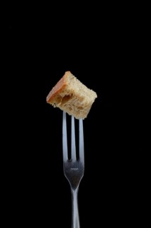 Bread cubes on fondue fork