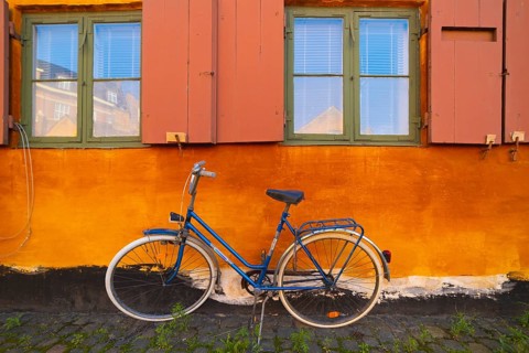 Bike leaning against the orange wall