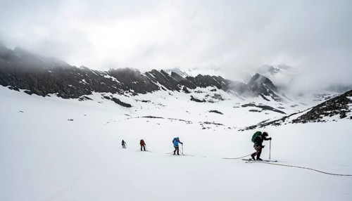 Ski tourers ascending the rope