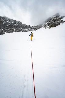 Ski tourers ascending the rope