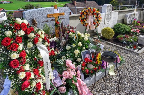 Fresh graves with flower decorations
