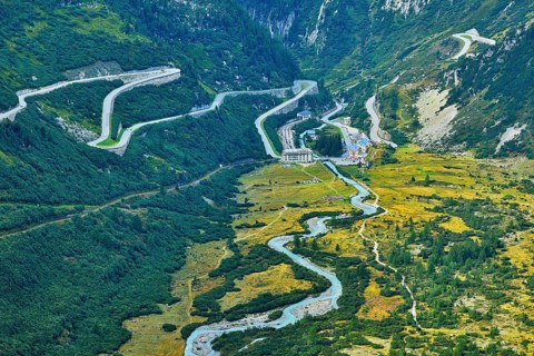 View from the Rhone glacier of the glacial stream and the pass roads