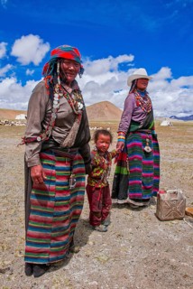 Traditional dressed women with a child