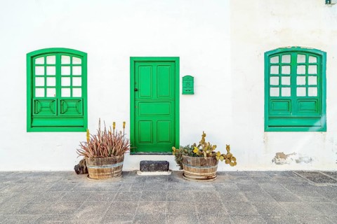Picturesque white and green settlement called Pueblo Marinero designed by Cesar Manrique located in Costa Teguise