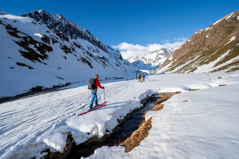 Ski tourers in a valley at Oberbergbach