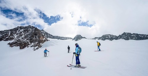 Group of ski tourers and splitboarders on the descent at Alpeiner Ferner