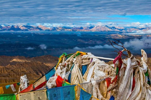 Prayer flags over the eroded mud landscape in the kingdom of Guge