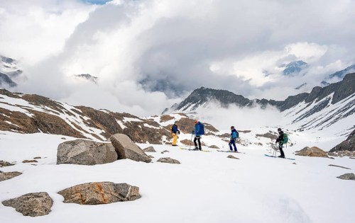 Ski tourers in winter in the mountains