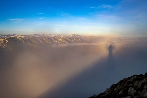 Shadow cast by the photographer in the fog