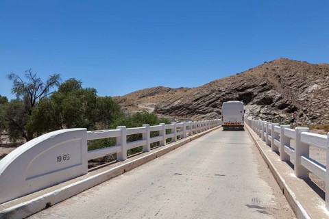 Coach crossing a bridge over the Kuiseb River