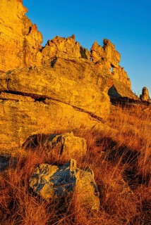 Savannah and huge rock formations at sunset in the Isalo National Park