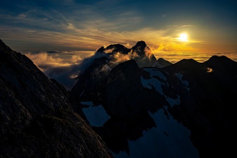 Altmann summit with yellow cloud wisps at sunrise
