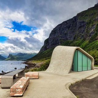 Ureddplassen rest area with wave-shaped concrete and glass toilet block