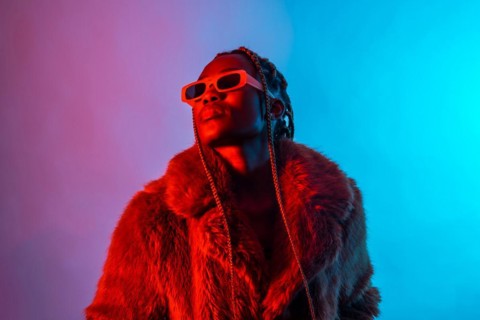 Black ethnic woman with braids with red and blue led lights