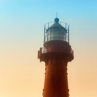 Red lighthouse in the haze