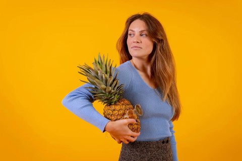 Woman with a pineapple in sunglasses