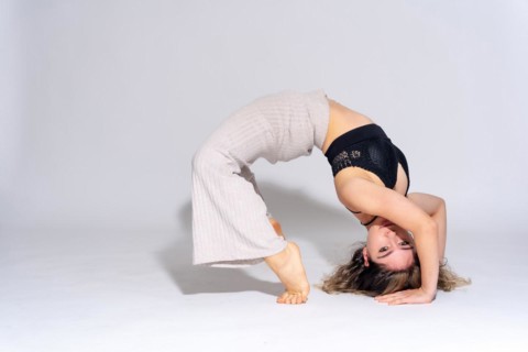 Young dancer in studio photo session with a white background
