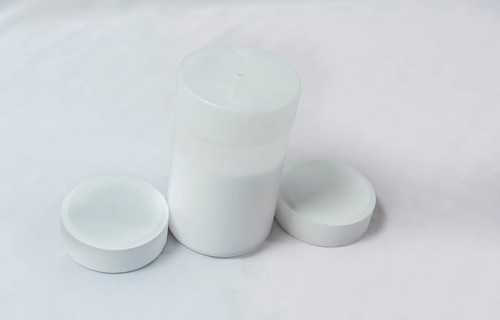 Chlorine tablets for swimming pool disinfection on white background