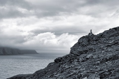 Rocky coast near Skarsvag with view to the North Cape