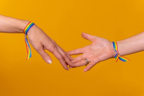 Hands of two women caressing and touching fingers