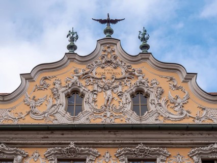 Facade view of the Falkenhaus with stucco facade in rococo style in the centre of Wuerzburg
