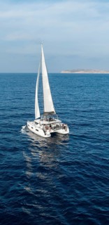 Sailing catamaran in full sail