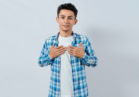 Person gesturing the word HAPPINESS in sign language