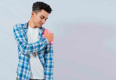 Young man with shoulder pain on white background. Shoulder and arm pain concept. People with shoulder pain on white background. Man suffering with shoulder muscle pain