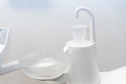 Plastic cup to rinse your mouth in the dental clinic with water