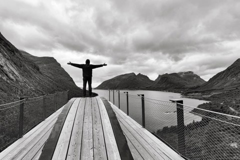 Tourist standing on observation platform Bergsbotn
