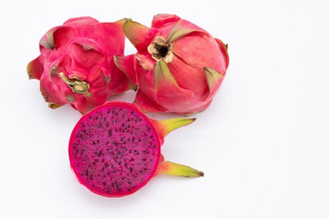 Pink pitahaya or dragon fruit isolated on white background with copy-space