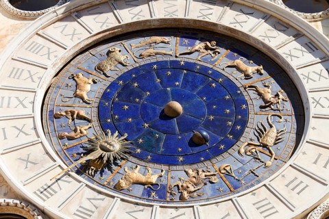 The astrological clock with moon phases and zodiac signs and dial made of Lapis Lazuli