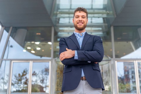Portrait businessman CEO of a company at glass office entrance