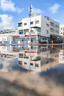 Typical white buildings and restaurants