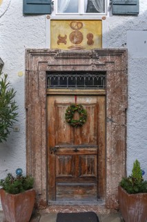Historic entrance door of a former bakery on Fraueninsel