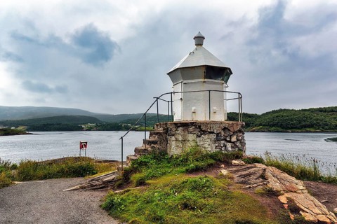 Small white lighthouse at the tidal stream Saltstraumen