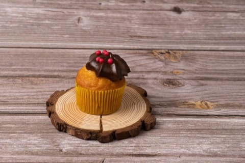 Assortment of chocolate and cream and carrot cupcakes on various backgrounds