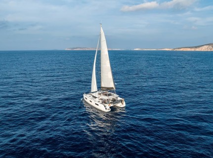 Sailing catamaran in full sail