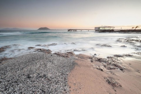 Long exposure at sunrise at the coast near Corralejo
