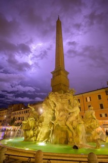 Four-flow fountain in Piazza Navona during a thunderstorm