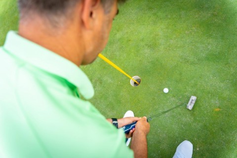 Man playing golf