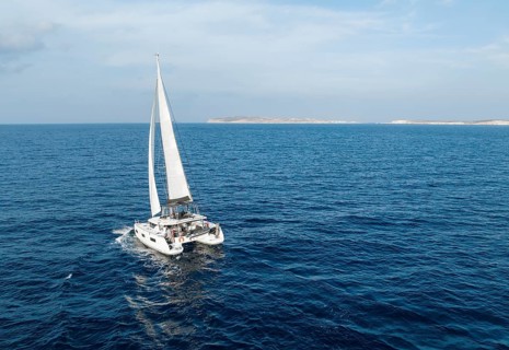 Sailing catamaran in full sail