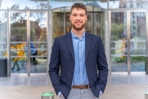 Portrait young businessman CEO of a company at the entrance of the office