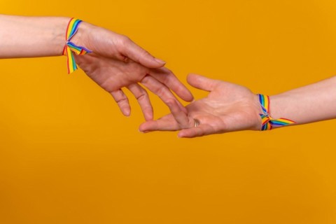 Hands of two women caressing and touching fingers