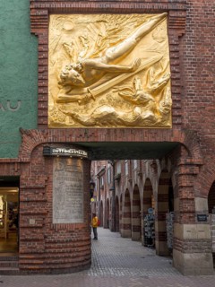 Entrance to Boettcherstrasse with gilded bronze relief by Bernhard Hoetger