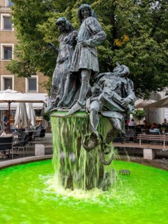 The wedding fountain with green water on the Amberg market square