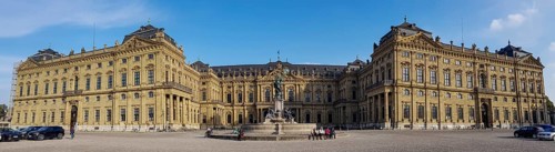 Panorama photo Frankoniabrunnen on the side of the Ehrenhof and Wuerzburg Palace Wuerzburg Residence and Court Garden