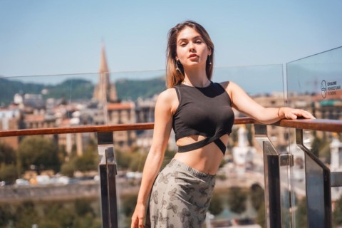 Portrait of a young model in a viewpoint of the city from the heights