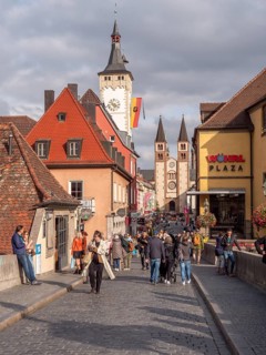 View from the Old Main Bridge towards the Grafeneckart Tower and the Romanesque-style Wuerzburg Cathedral on Domstrasse